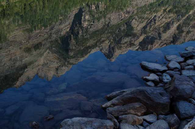 Reflection of mountain top in Avalanche Lake